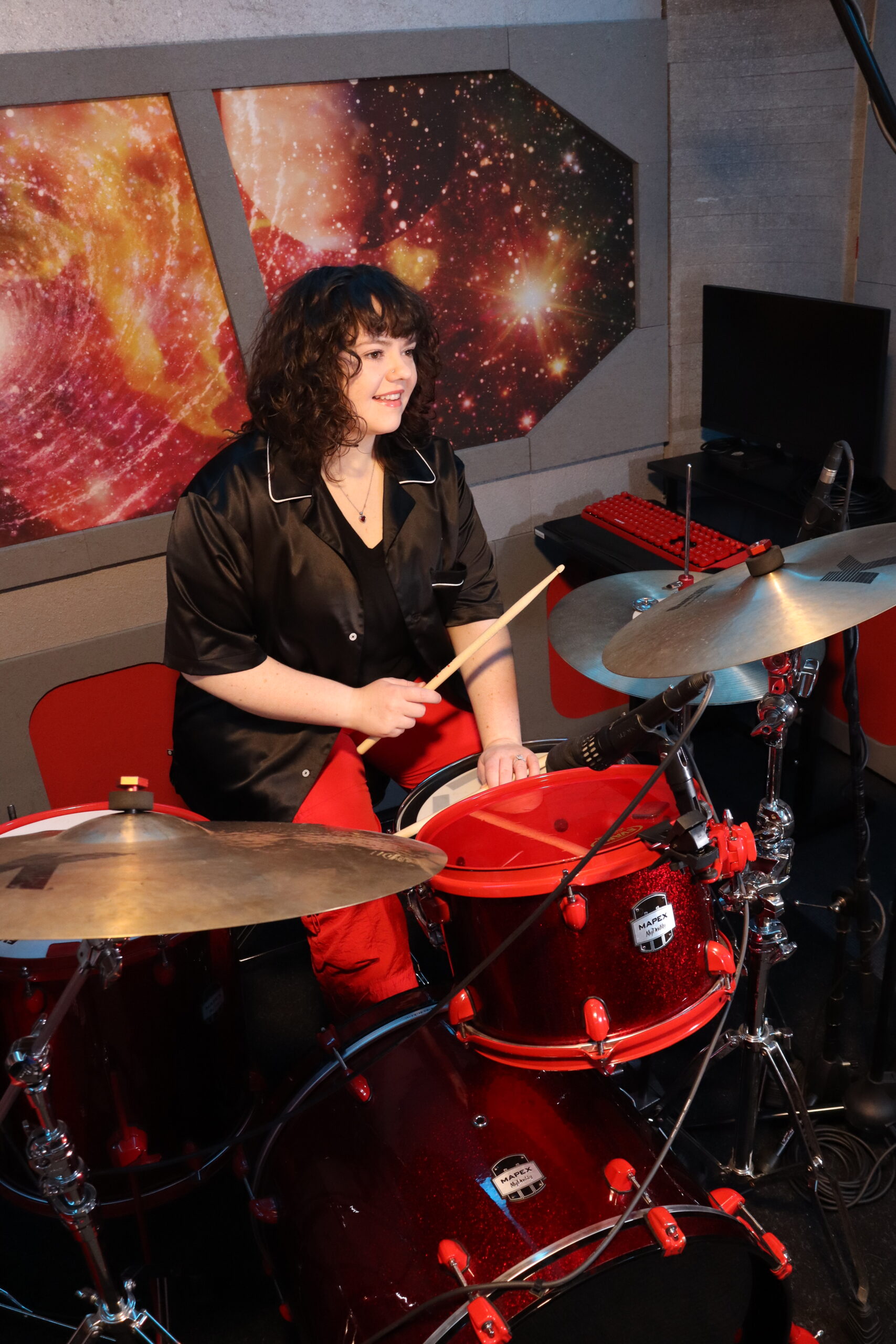 Lindsay Artkop plays drums