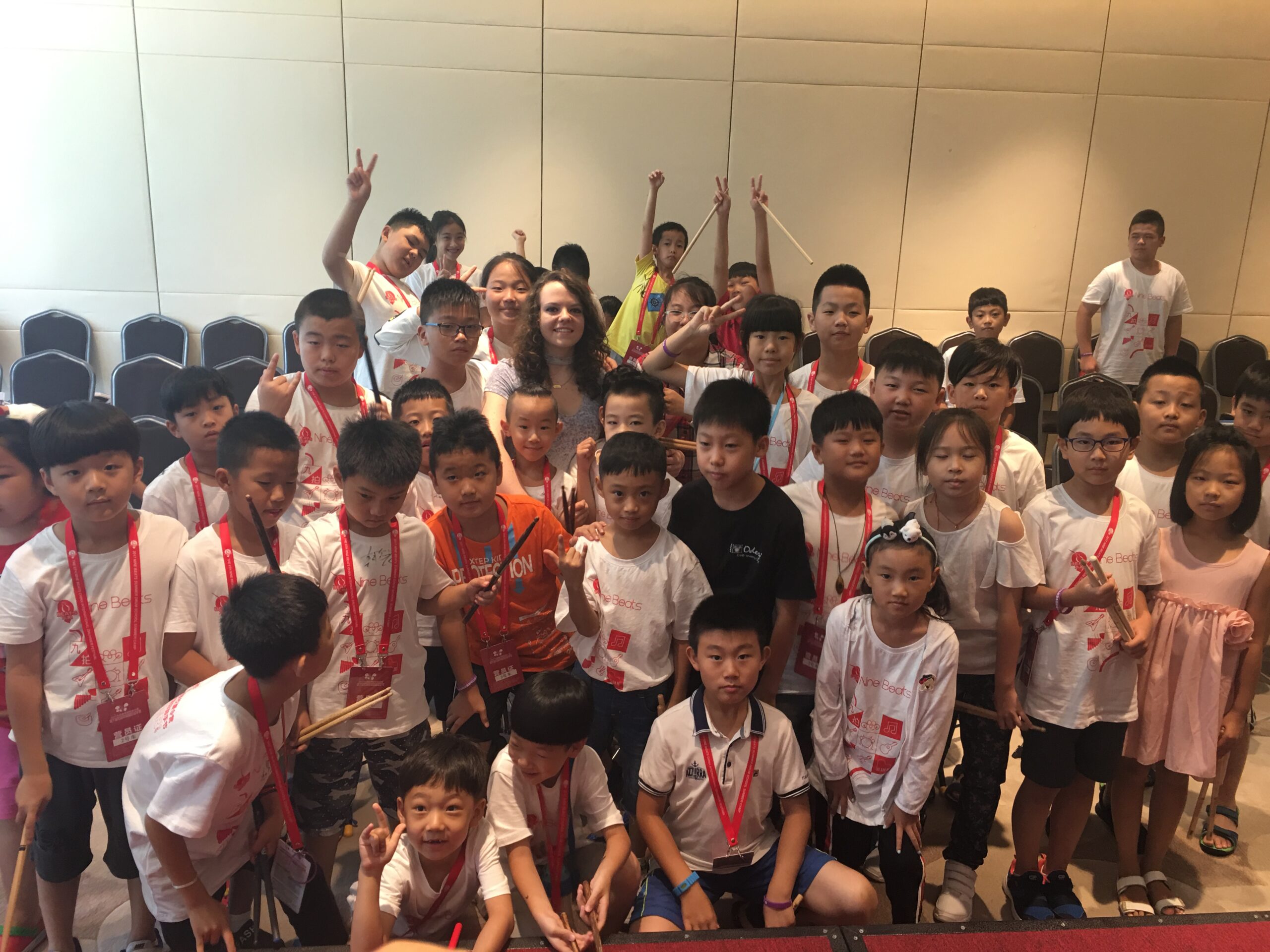 Lindsay Artkop with a group of drum students after a masterclass session