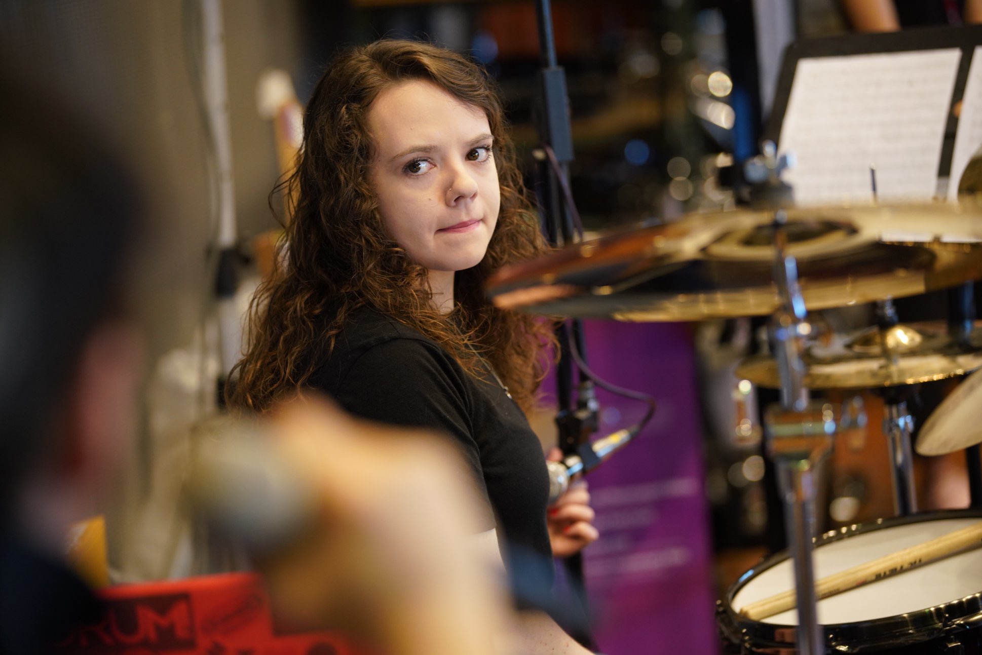 Lindsay Artkop teaching private online drum lesson at her studio drum set