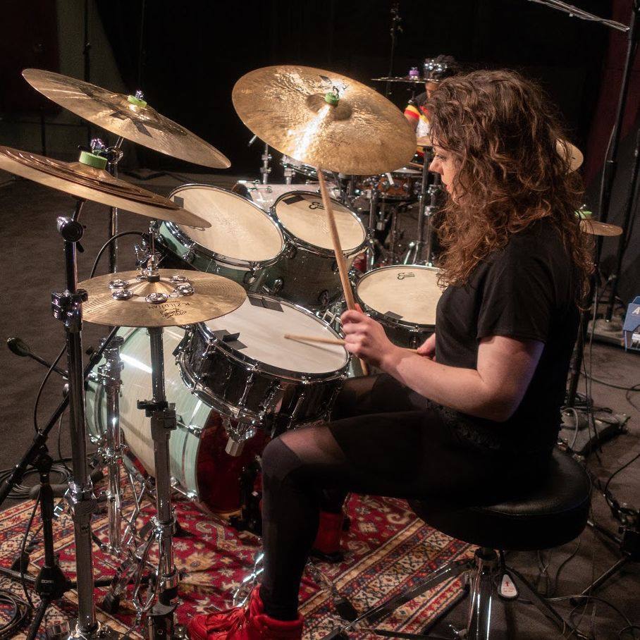 Lindsay Artkop performing and teaching private online drum lesson at her studio drum set
