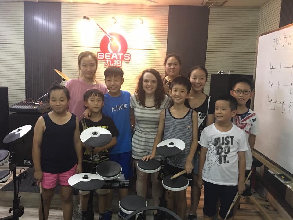 Lindsay Artkop with a group of drum students after a masterclass session