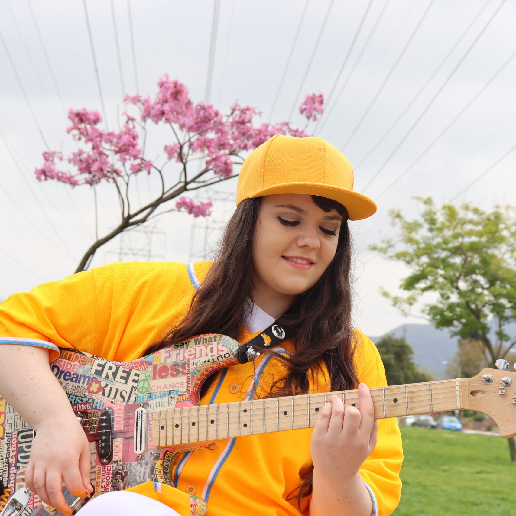 Lindsay Artkop Playing Guitar